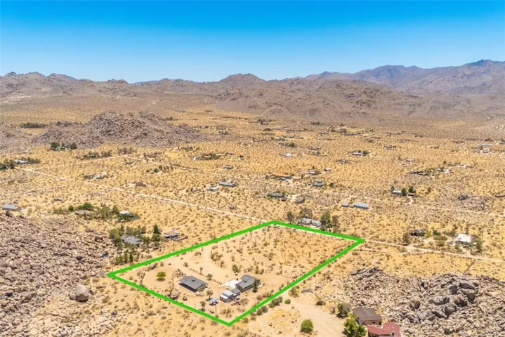 Views looking out toward Joshua Tree National Park, where the breathtaking desert landscape stretches to the horizon.