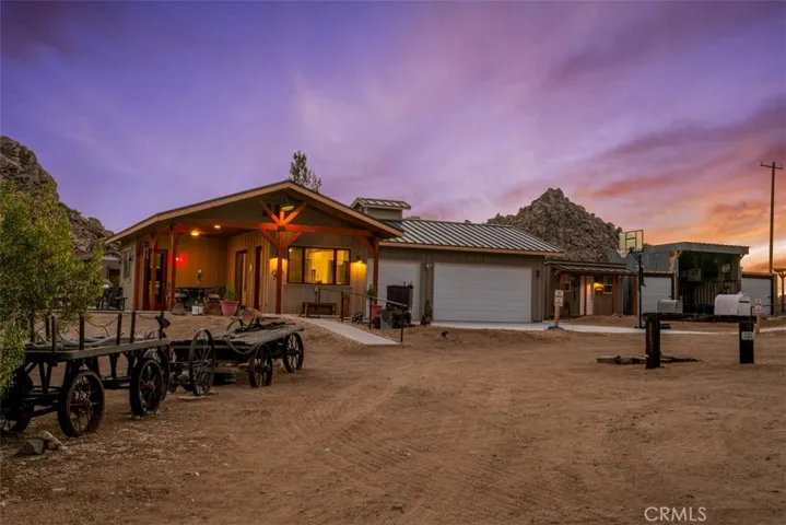Guest house and finished three-car garage, thoughtfully positioned to provide both privacy and functionality.