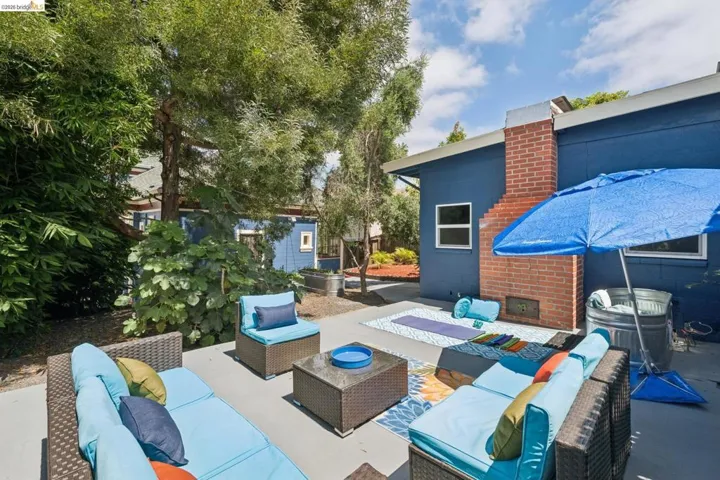 Patio with concrete flooring and a brick fireplace