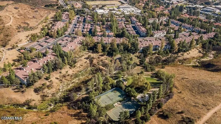 View of complex incl tennis court from t