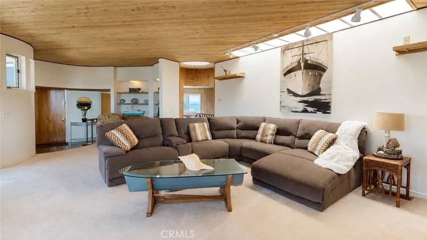 Spacious living room with distinctive curved architecture.