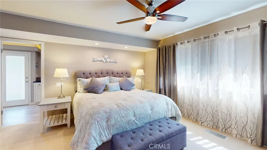 Peaceful primary suite filled with natural light.