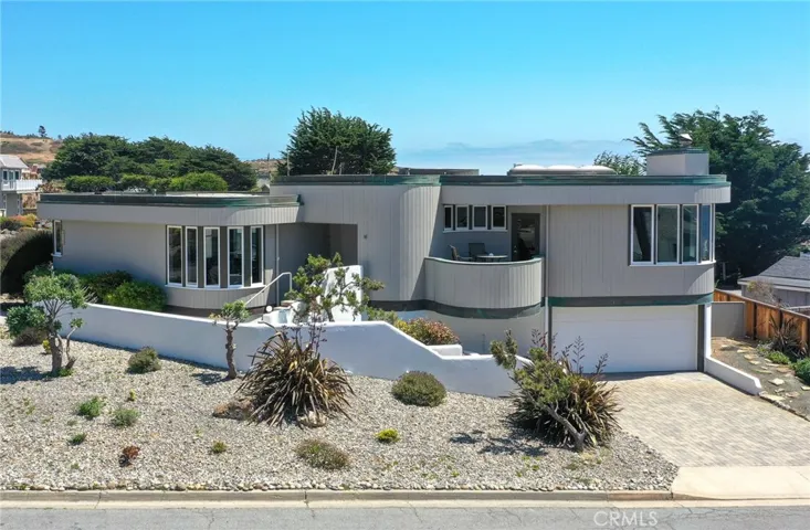 Graceful curves define this one-of-a-kind coastal residence.