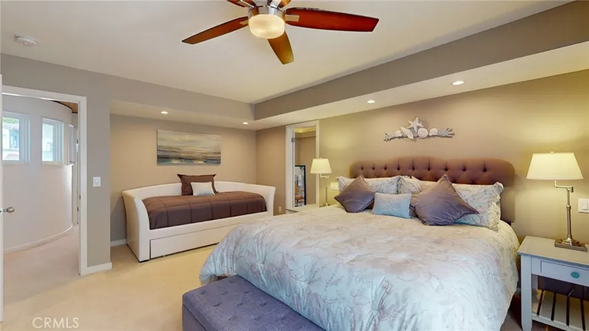 Spacious primary suite with sitting area and spa-inspired bath.