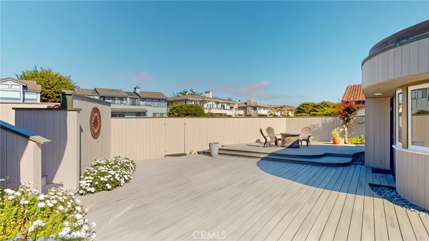 Expansive composite deck creates a private outdoor retreat for relaxing and entertaining.