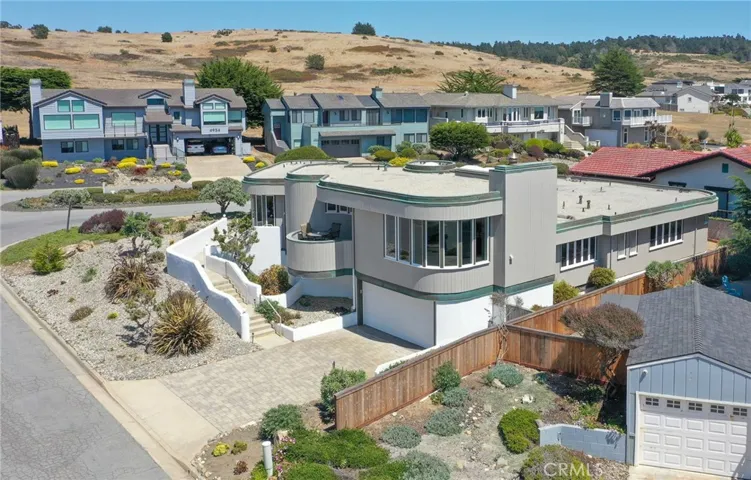 Distinctive curved architecture on a premier corner homesite.