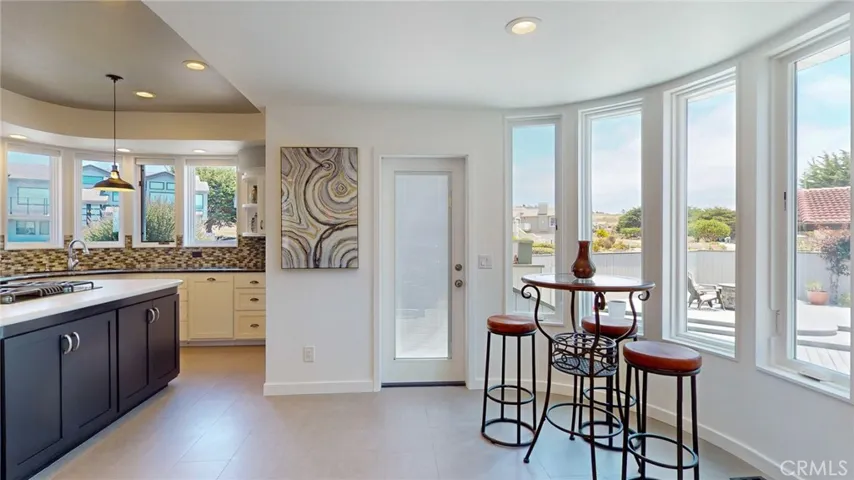 Sunny breakfast nook opens to the outdoor deck.