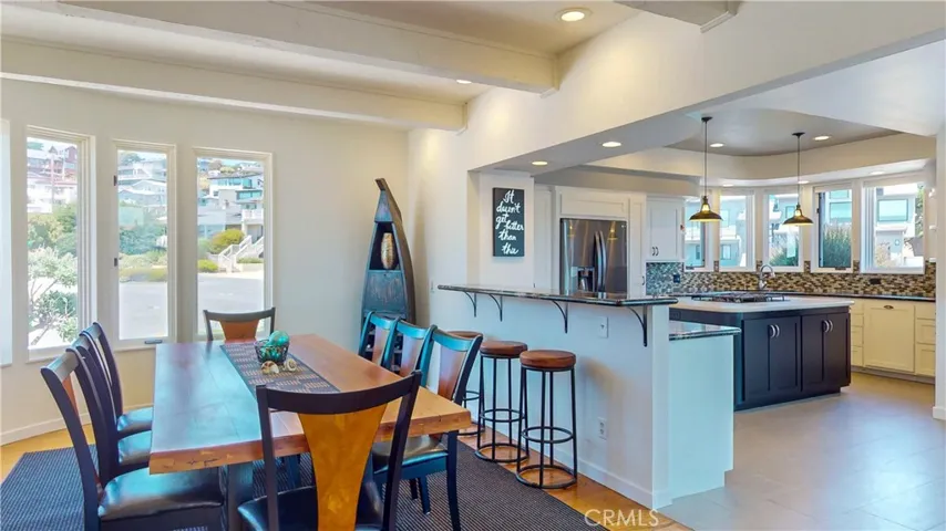 Open dining area flows seamlessly into the gourmet kitchen.