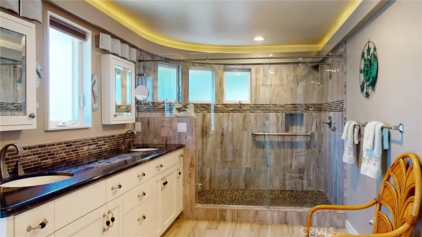 Spa-inspired primary bath with expansive walk-in shower.