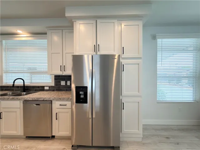 Detail kitchen - stainless steel fridge and dishwasher