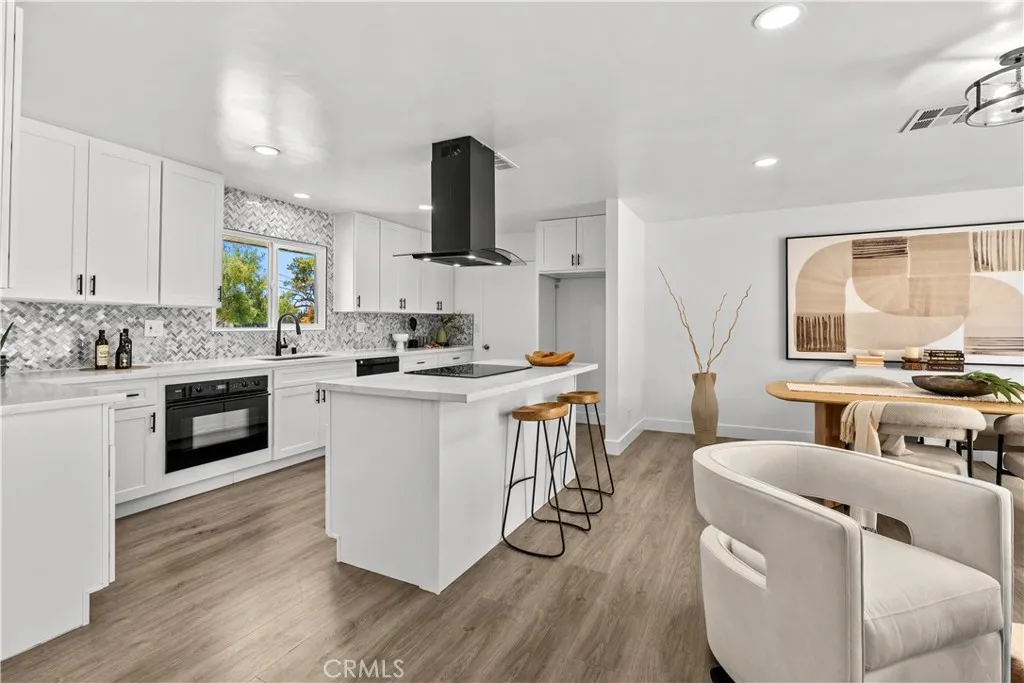 From the front hall to the kitchen.