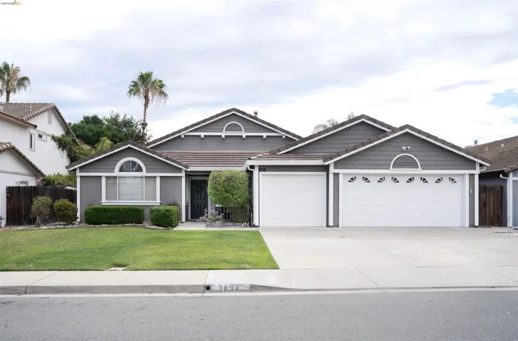 Gray exterior featuring shake siding accents and white trim