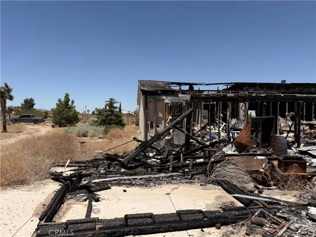 Straight-on view of burned-out back of home