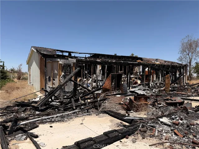 Severe fire damage to back of house