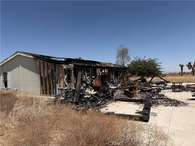 Fire-damaged rear exterior of home