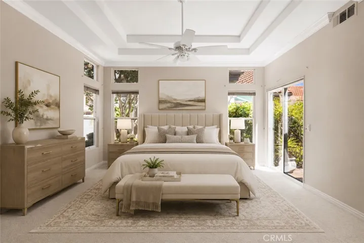 Spacious primary bedroom. Digitally enhanced with virtually staged furniture