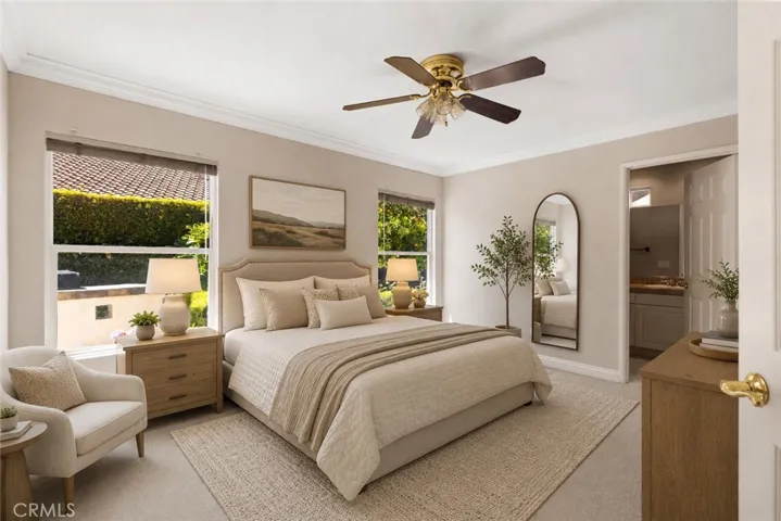 Secondary downstairs bedroom with en suite bathroom. Digitally enhanced with virtually staged furniture