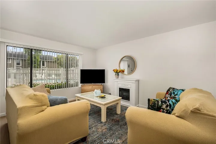 Light and bright living room with pool view!