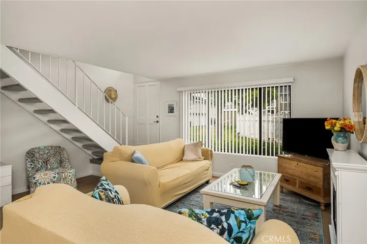 Living Room looking towards front door and stairs to 2nd level.