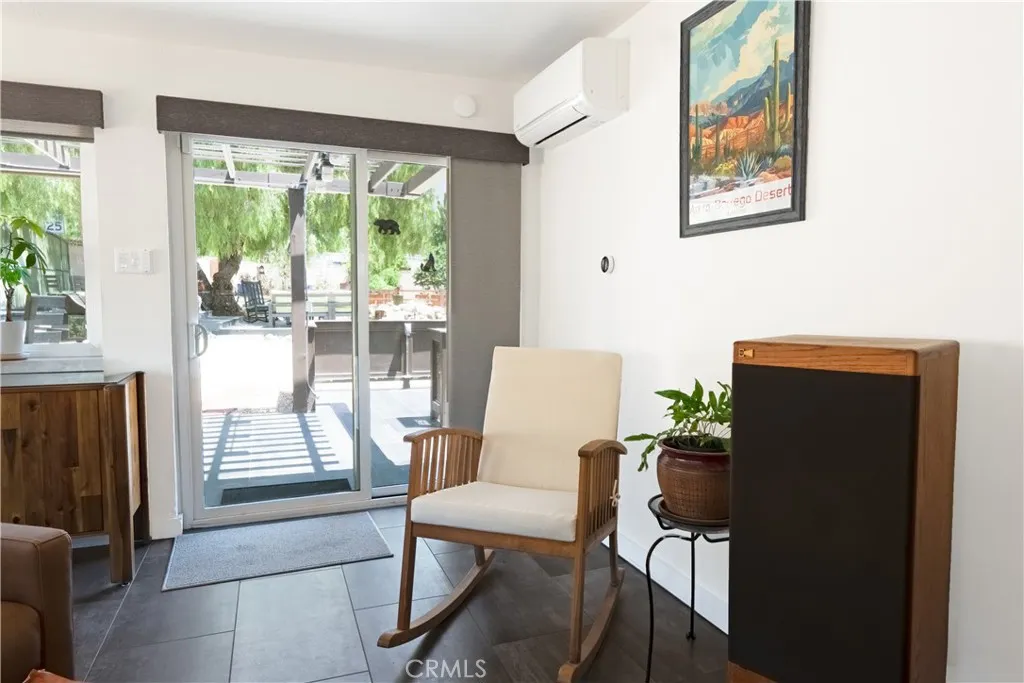 Lounge sliding door out onto pergola covered patio Lounge sliding door out onto pergola covered patio