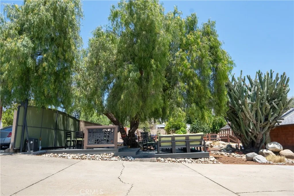 Beautiful established pepper tree with TREX deck surrounding it Beautiful established pepper tree with TREX deck surrounding it
