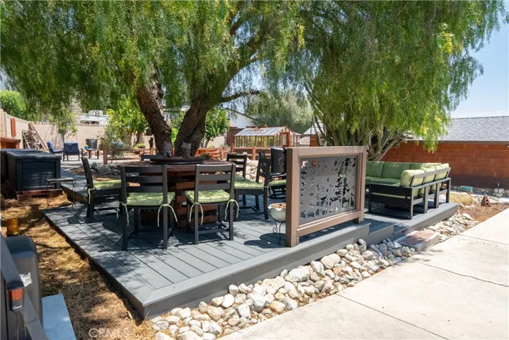 Large TREX deck under shady pepper tree