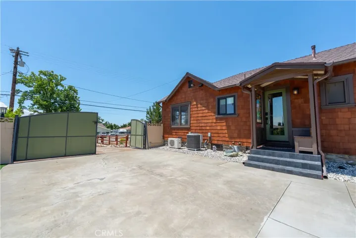 Rear East side of house with large gate for RV parking