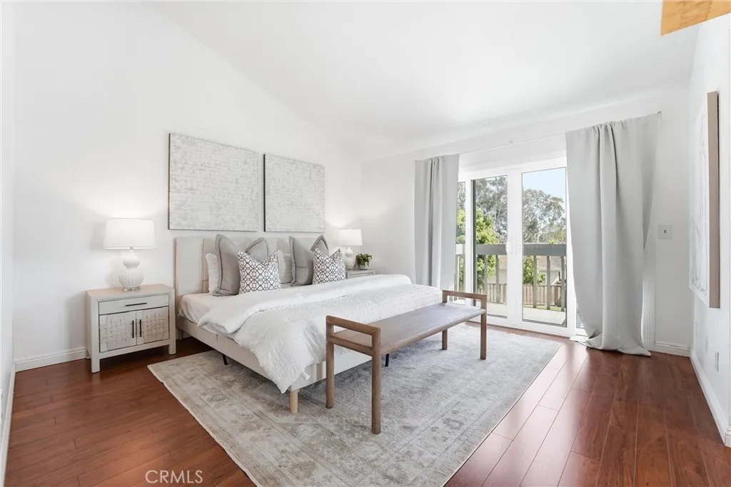 Primary bedroom with balcony