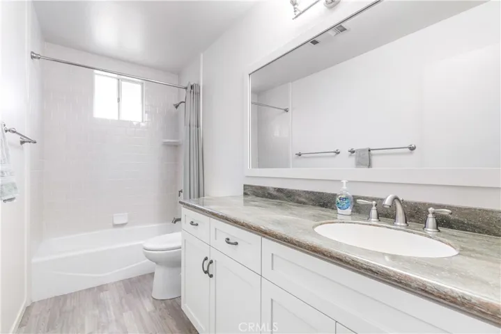 This updated full bathroom is designed for both style and utility, featuring a sleek, modern shower/tub combo. The recent updates create a fresh, clean space that perfectly balances everyday practicality.