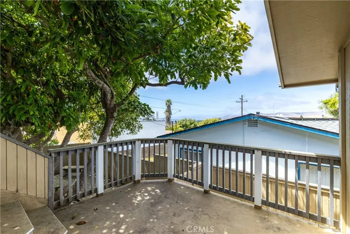 Capturing the iconic coastal scenery of Morro Bay, the view is framed perfectly as seen directly from the comfort and privacy of the main suite's spacious balcony, offering a glimpse of the central coast’s unique landscape and maritime atmosphere.