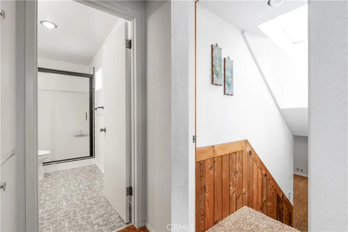 A thoughtful layout places the primary suite on its own floor, while a dedicated staircase connects it seamlessly to the versatile bonus room and full bath below.