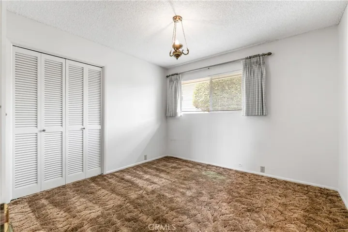 The third bedroom, mirroring the second, provides a perfect, quiet environment for a home office, hobby room, or creative studio. Each room is thoughtfully designed to offer flexible utility to suit your specific lifestyle needs.