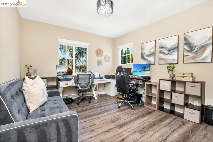 Bright room featuring LVP flooring and neutral-toned walls
