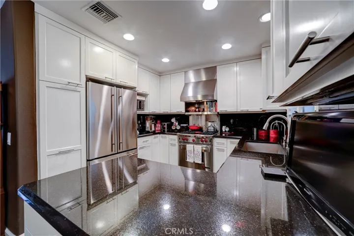 Kitchen w/ Wolf stove & double door fridge