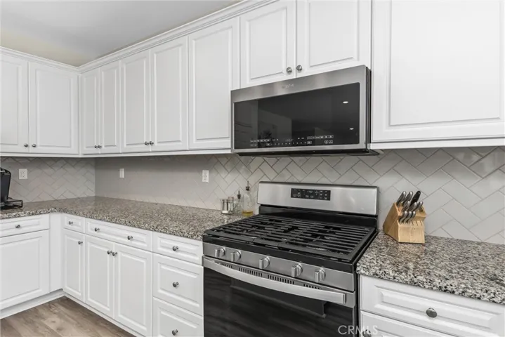 5 burner gas stove and state of the art microwave. There is plenty of countertop space and cabinets for storage