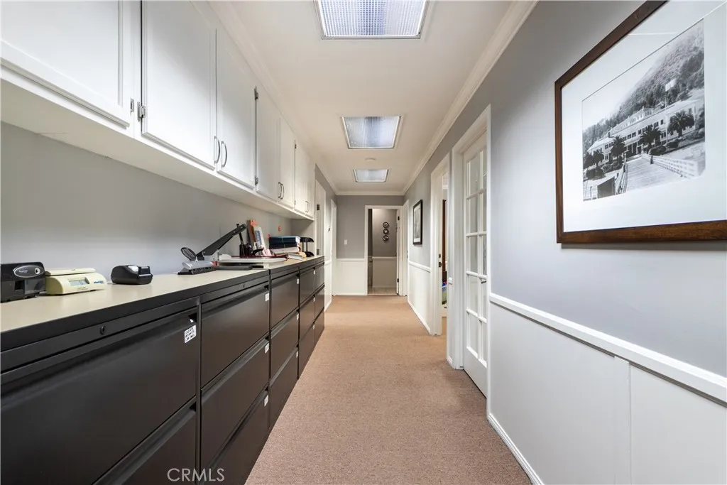 Inside hallway leading to all the offices, conference room and restroom for unit 204.
