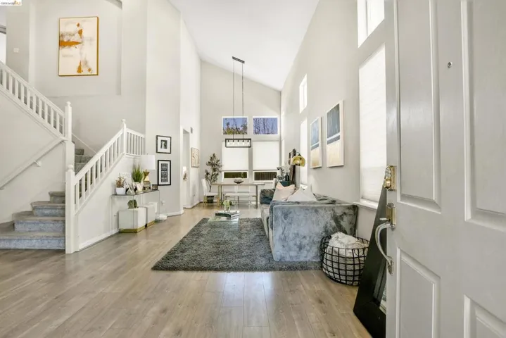 Vaulted ceilings complement the light wood-finish flooring