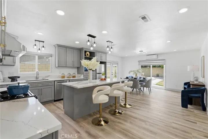 Remodeled Kitchen with Big Quartz Island and Quartz Counter Top