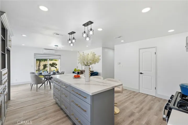 Remodeled Kitchen with Big Quartz Island and Quartz Counter Top