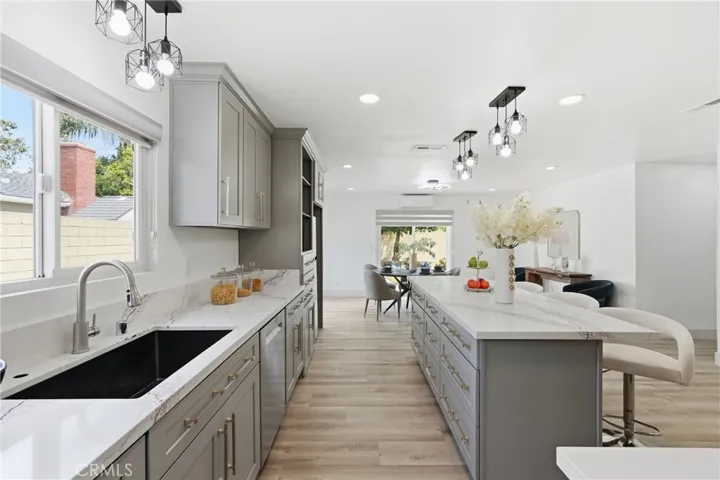 Remodeled Kitchen with Lots of Cabinetries and Quartz Counter Top