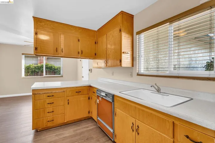 Kitchen featuring light wood cabinetry and light-colored countertops