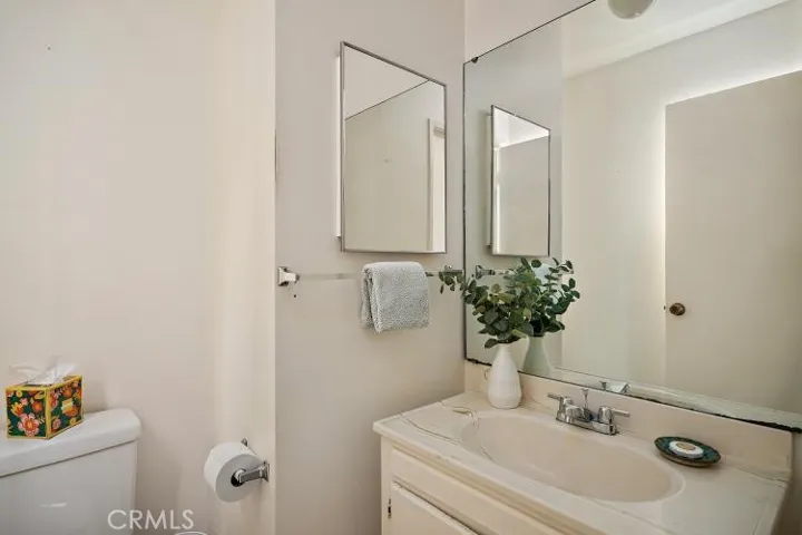 This is the first bathroom which is located off of the living area by the kitchen.