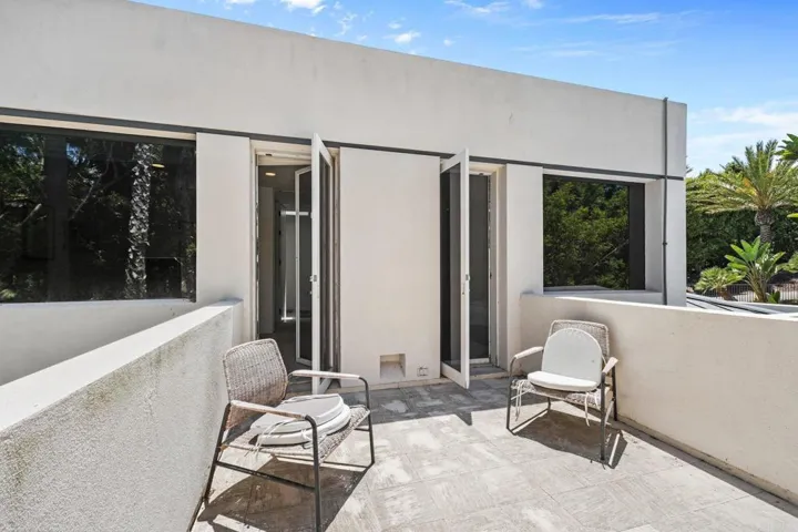 Second Floor Balcony Flanking Both Second Floor Bedrooms and Facing Side Yard