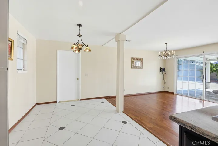 Kitchen looking to family and backyard sliding door