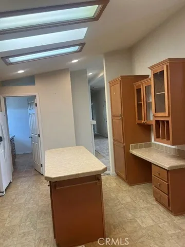 Beautiful, Spacious, Chefs Kitchen featuring a Center Island, Pantry, Secretariat, Skylight, Breakfast Nook and all appliances. Adjacent separate Laundry Room
