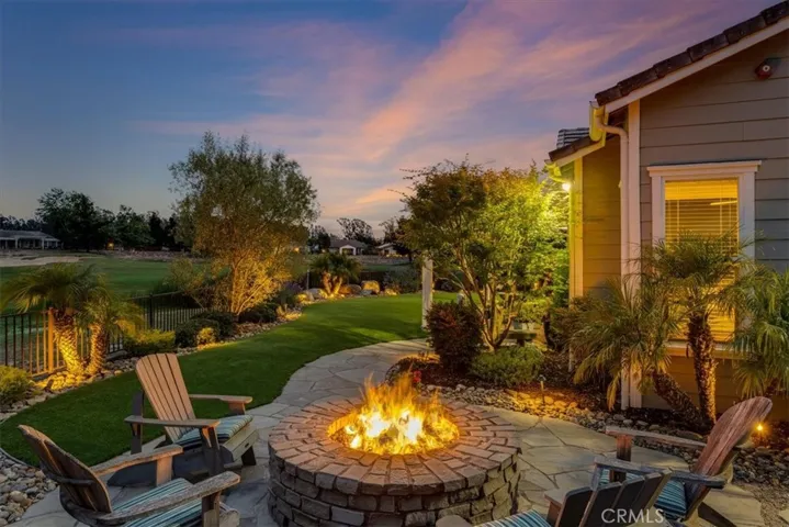 Firepit, 3 covered patios, expansive flagstone sitting areas.