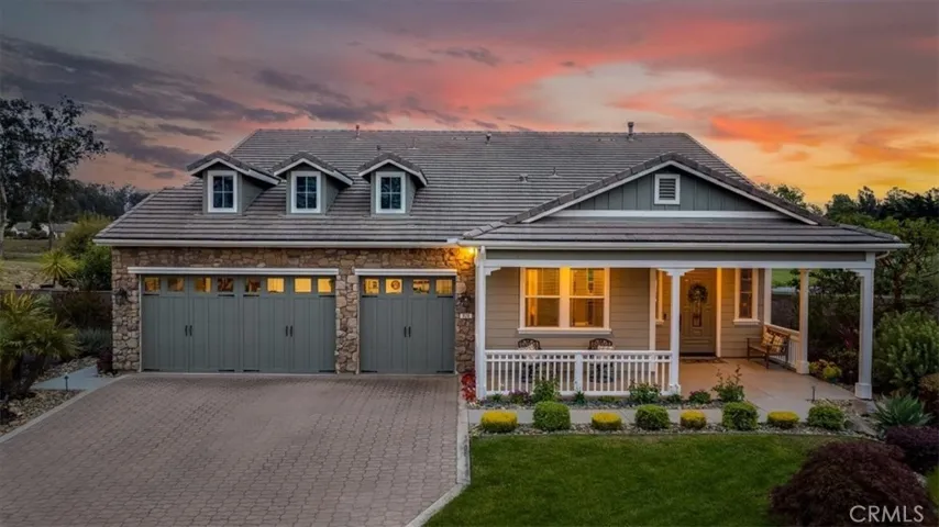Front porch covered patio and 3 car garage.