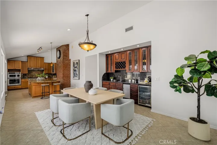 Dinning Room, has a wet bar with small sink, mini fridge and additional storage