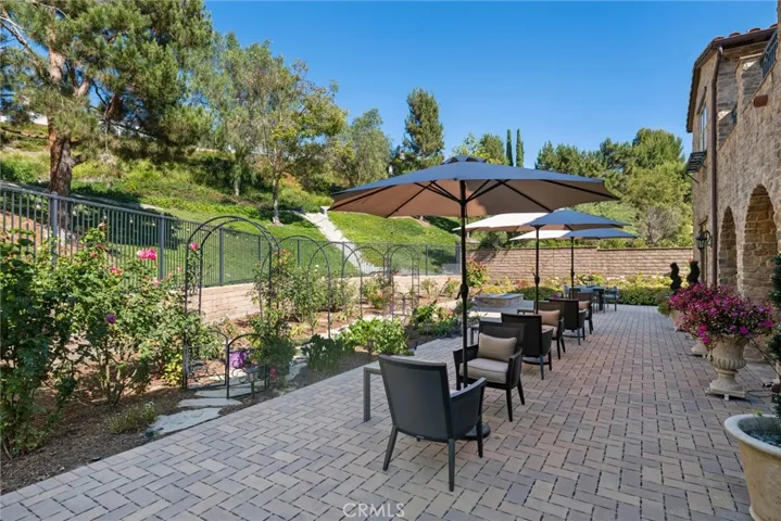 The interior courtyard provides an additional outdoor gathering area with its inviting fireplace