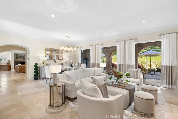 soaring ceilings, custom crown molding, rich millwork, designer lighting